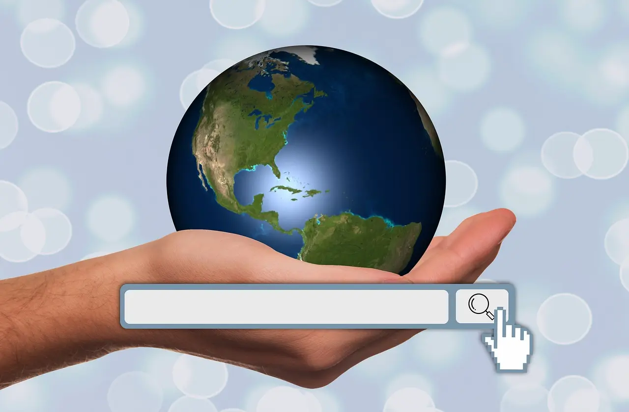 A hand gently cradling a digital globe, with a prominent search bar and magnifying glass icon in the foreground, symbolizing global and local online search. This image represents the focus on local SEO strategies for freelancers and small businesses by Launchpad Web Designs, emphasizing the ability to connect with a wider audience and be found in local search results.