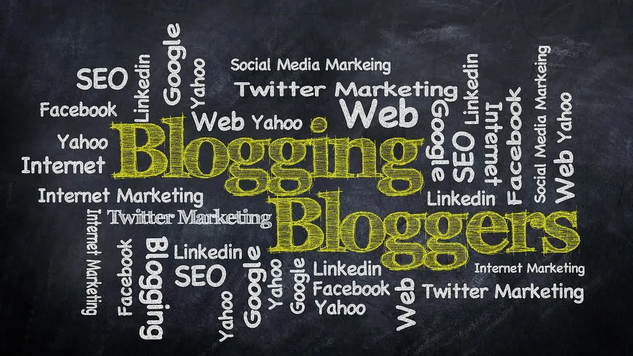 A chalkboard word cloud with 'Blogging' and 'Bloggers' prominently displayed, surrounded by keywords like SEO, Social Media Marketing, Web, Google, and LinkedIn, representing the diverse topics and insights covered on the Launchpad Web Designs blog.
