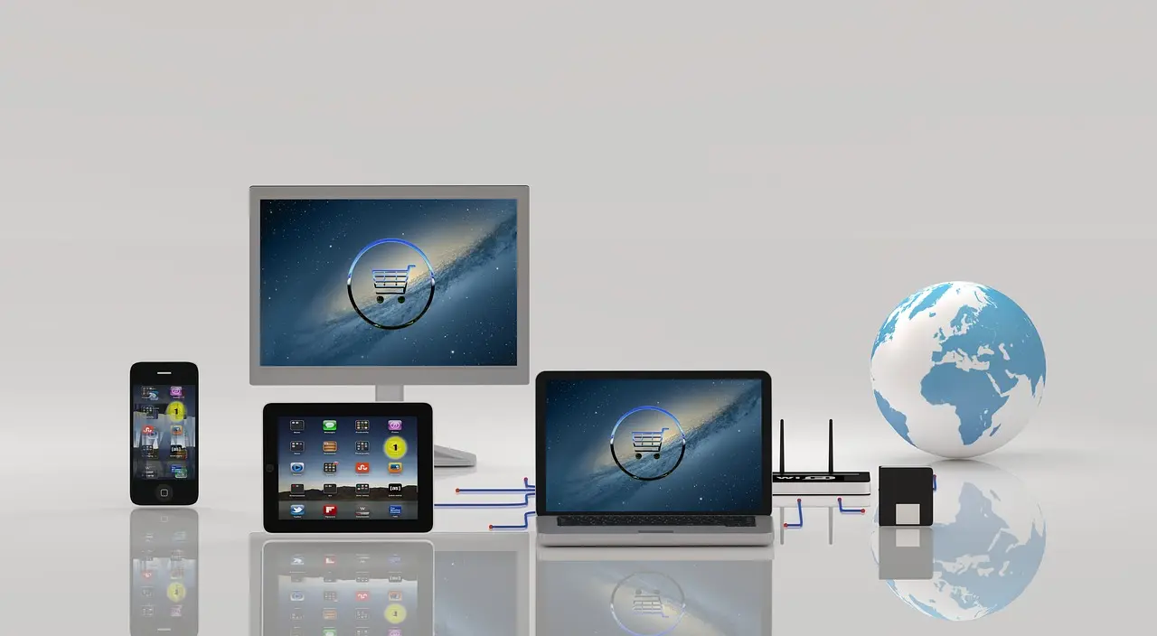 A display of interconnected digital devices including a smartphone, tablet, desktop, and laptop, all featuring a shopping cart icon on their screens, alongside a globe and router. This image symbolizes Launchpad Web Designs' comprehensive e-commerce setup services, ensuring seamless online store functionality across all devices for global reach.