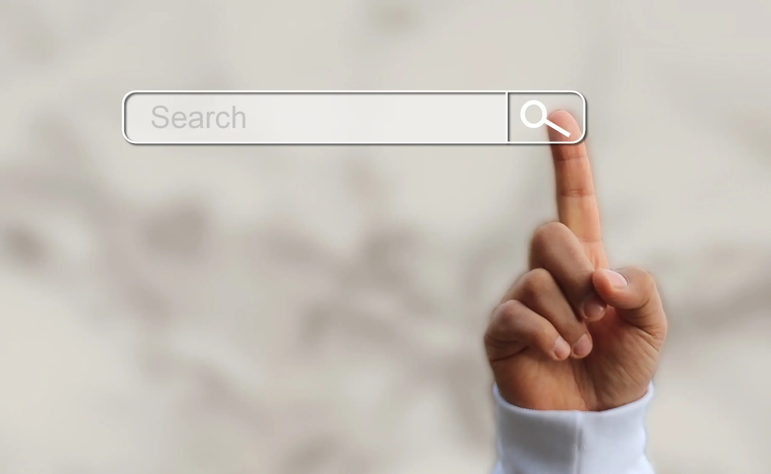 Finger touching a search bar with a magnifying glass icon, illustrating the focus on search and visibility in Launchpad Web Designs' Local SEO Guide for Small Businesses.